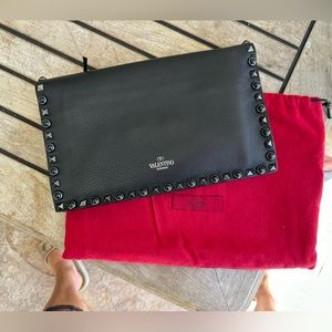 Unique Valentino clutch/ wristlet with black stone and black studs